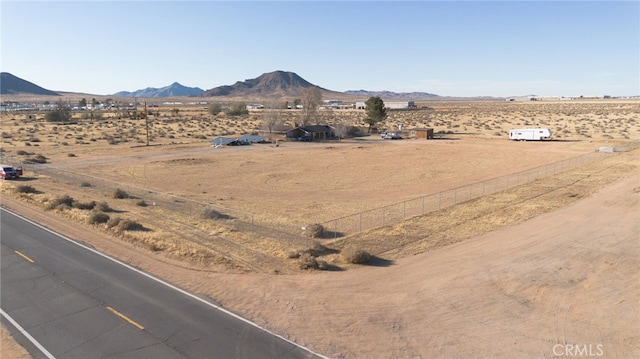 mountain view featuring a desert view and a rural view