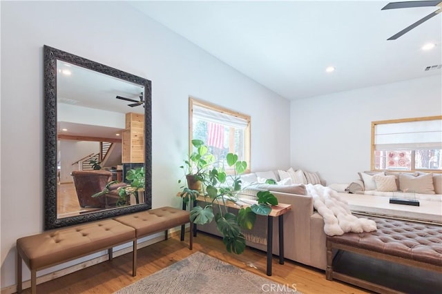 interior space featuring a ceiling fan, recessed lighting, visible vents, and wood finished floors