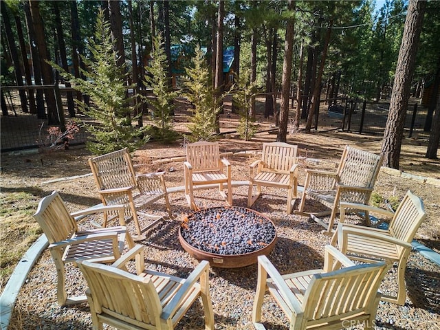 view of patio / terrace with a fire pit