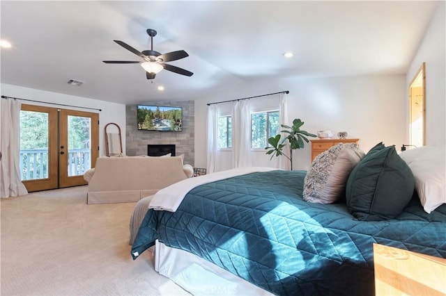 bedroom featuring light carpet, visible vents, access to exterior, vaulted ceiling, and french doors