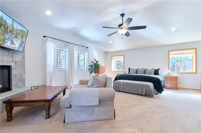 bedroom featuring a ceiling fan, recessed lighting, carpet flooring, and a fireplace