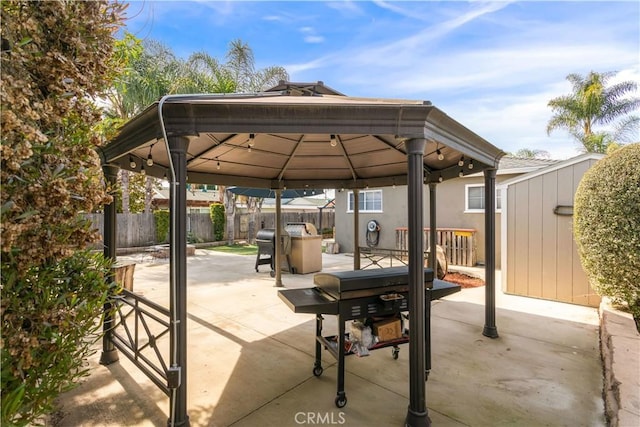 view of patio / terrace featuring a fenced backyard and a gazebo