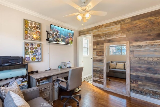 office area with ornamental molding, wood finished floors, and a ceiling fan