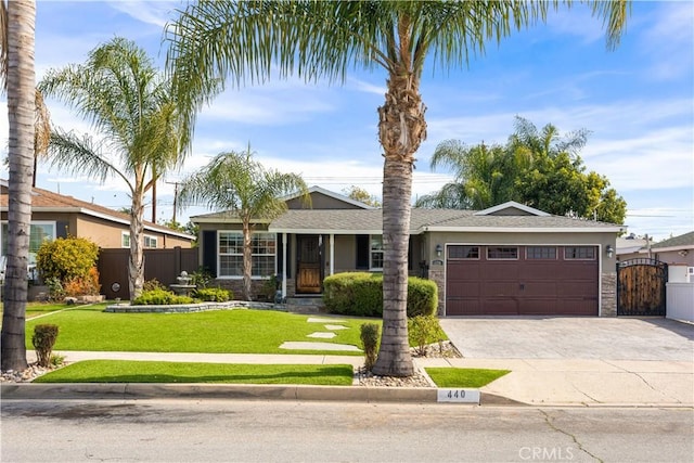 ranch-style house with driveway, a garage, a gate, fence, and a front lawn