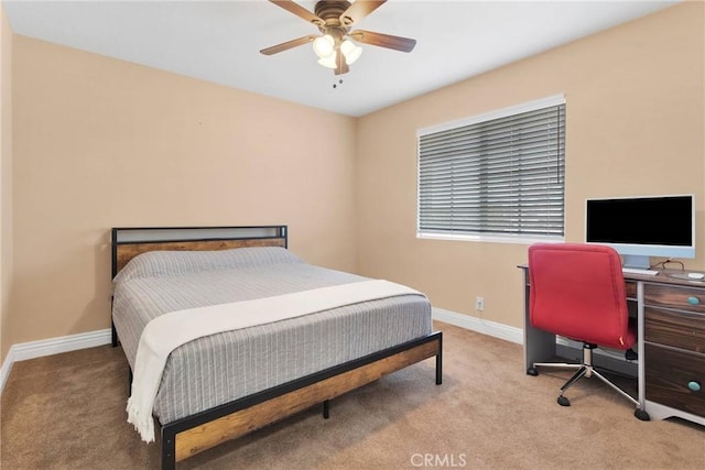 bedroom featuring a ceiling fan, carpet flooring, and baseboards