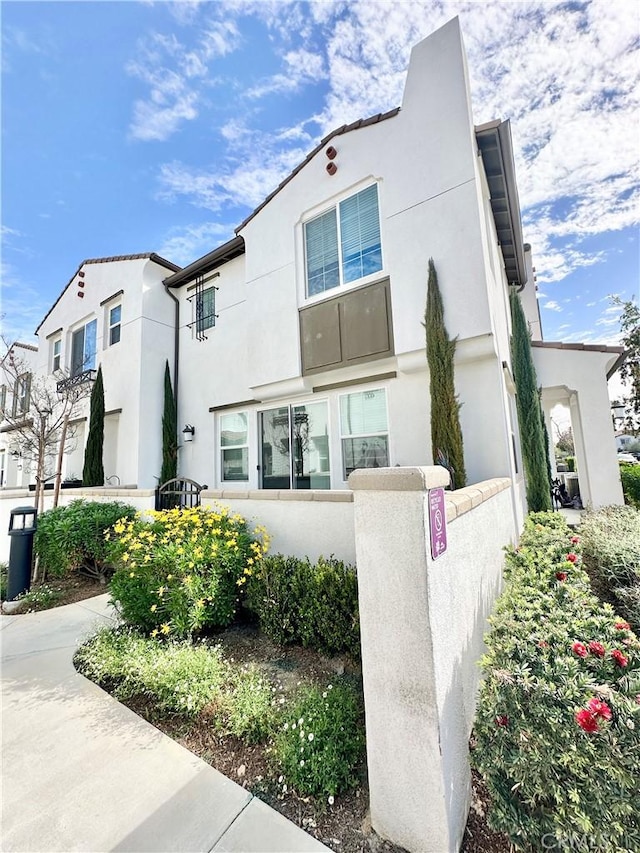 view of front of house featuring stucco siding