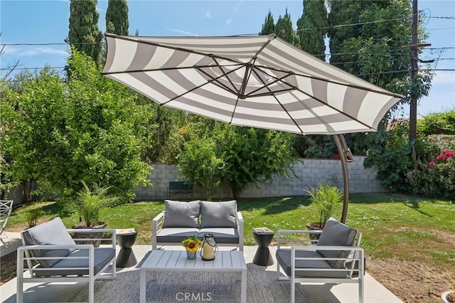 view of patio featuring a fenced backyard and an outdoor living space