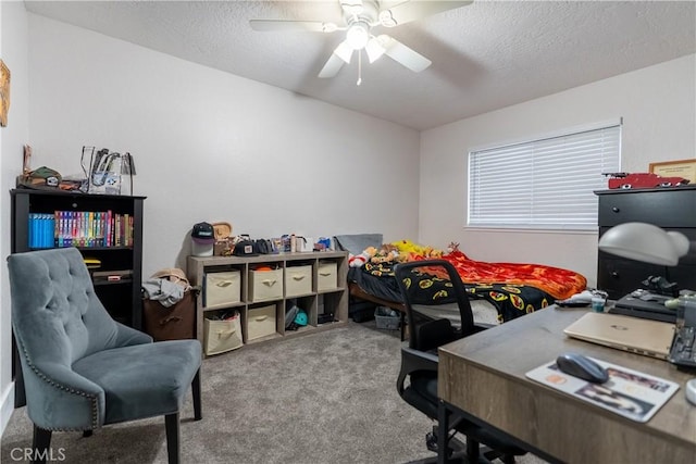 bedroom featuring a textured ceiling, carpet, and a ceiling fan