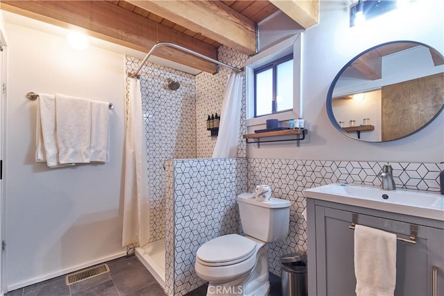 full bath featuring toilet, vanity, visible vents, a shower stall, and beam ceiling