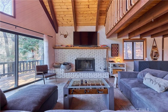 living area with a brick fireplace, beam ceiling, and wooden walls