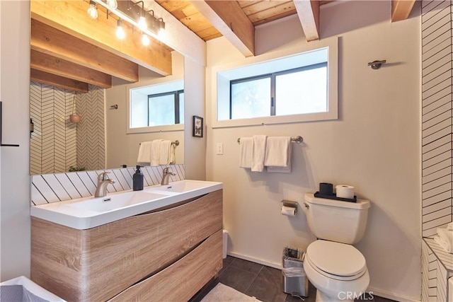 full bathroom featuring toilet, backsplash, beam ceiling, tile patterned floors, and double vanity