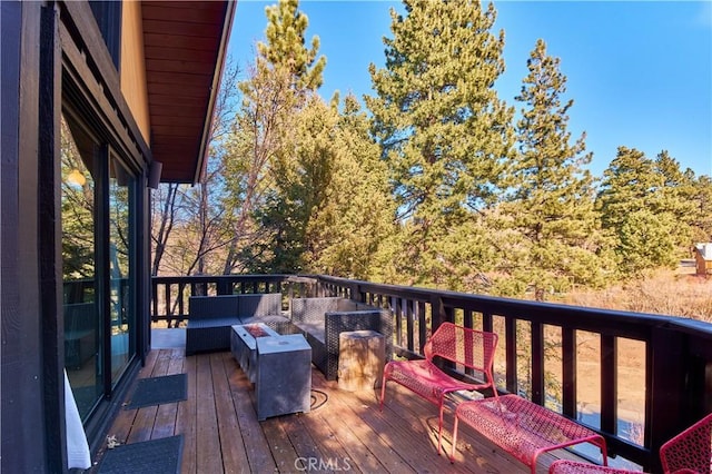 wooden deck featuring outdoor lounge area