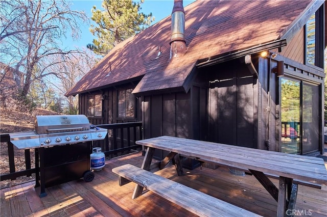 wooden terrace featuring area for grilling