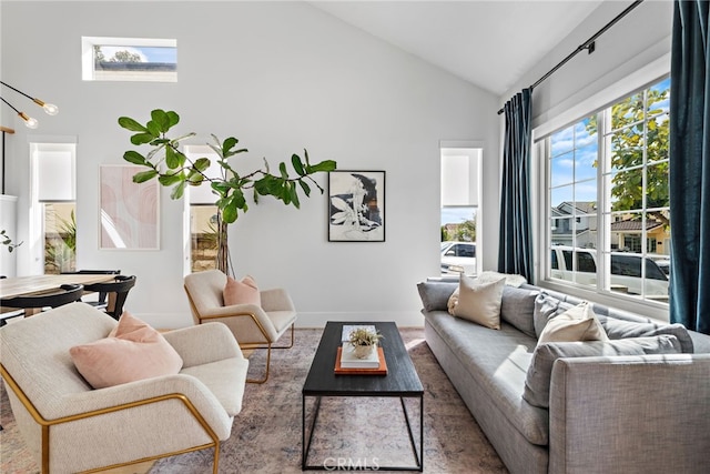 living room with high vaulted ceiling