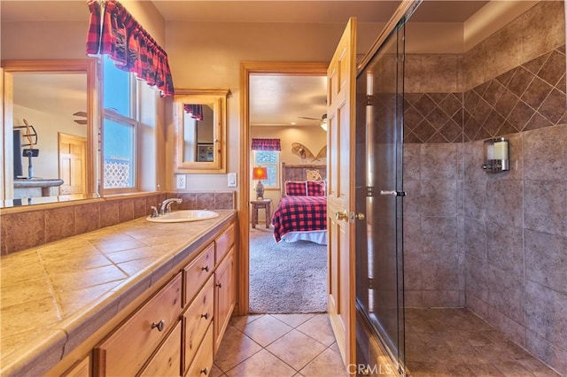 full bath featuring a shower stall, ceiling fan, connected bathroom, and vanity