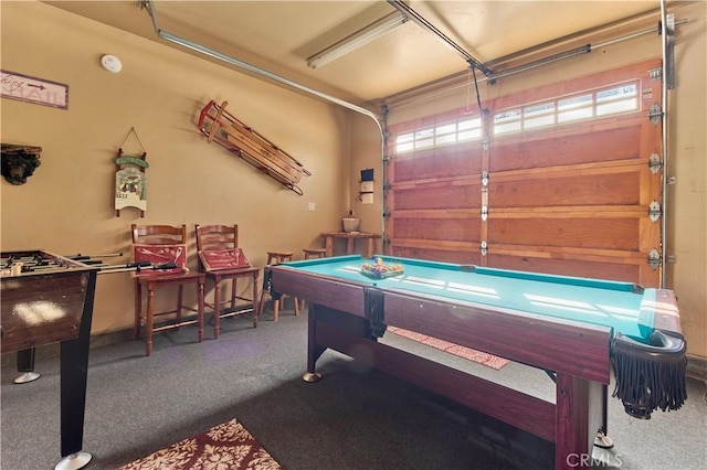 playroom featuring a garage and carpet flooring