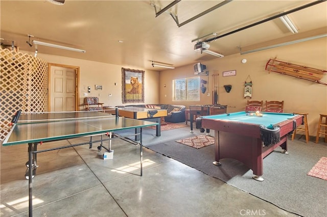 recreation room featuring concrete flooring, billiards, and a garage