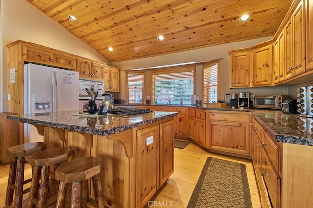 kitchen with lofted ceiling, wooden ceiling, white appliances, a sink, and a kitchen island