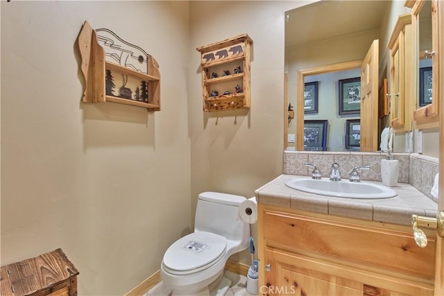 half bath with vanity and toilet