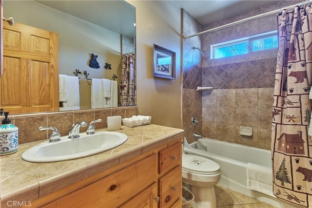 full bath with shower / tub combo, toilet, tile patterned floors, vanity, and backsplash