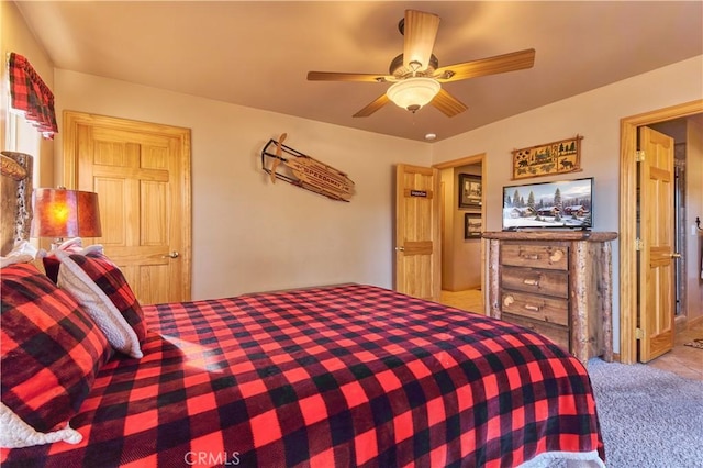 carpeted bedroom with a ceiling fan