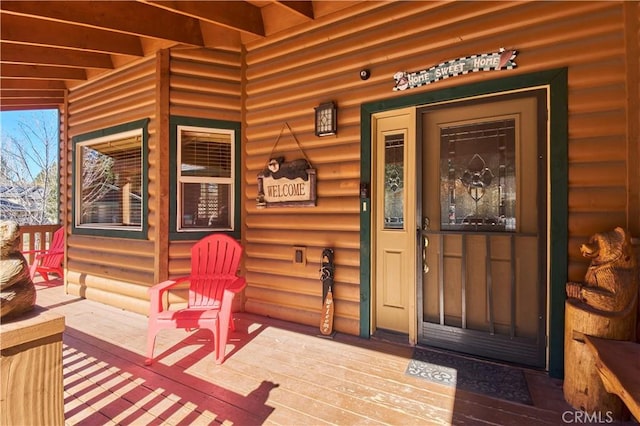 entrance to property featuring a porch