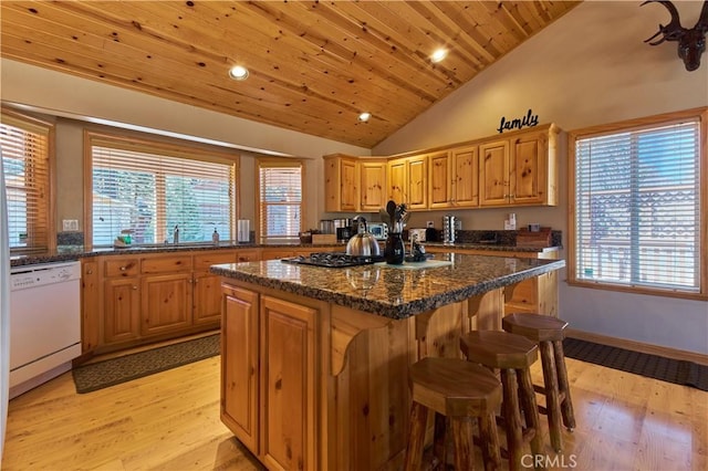 kitchen featuring light wood-style flooring, wood ceiling, a kitchen island, vaulted ceiling, and white dishwasher