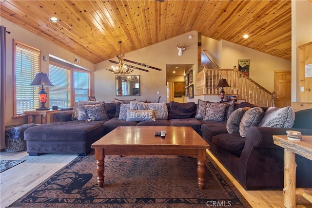 living room with wooden ceiling, stairway, a chandelier, and wood finished floors