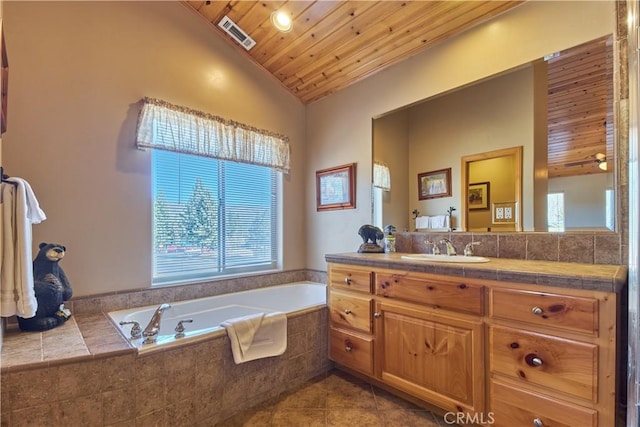 bathroom featuring lofted ceiling, wooden ceiling, a garden tub, vanity, and tile patterned floors