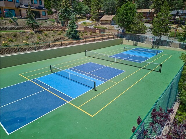 view of sport court with fence