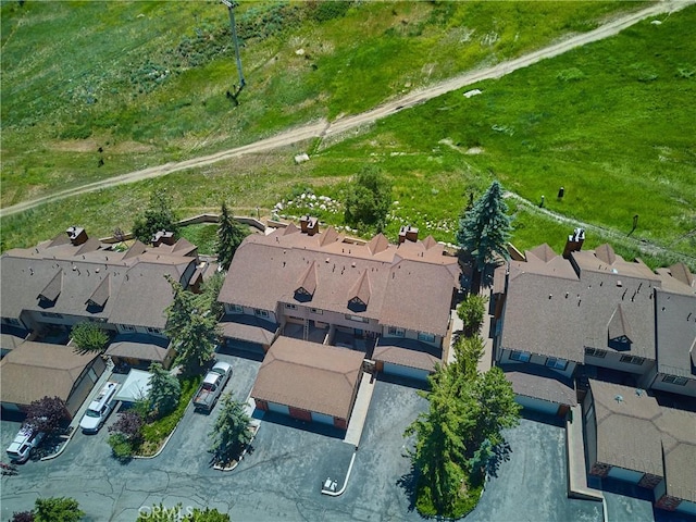 birds eye view of property with a residential view