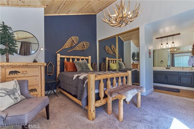 bedroom with a chandelier, wooden ceiling, light colored carpet, and a sink