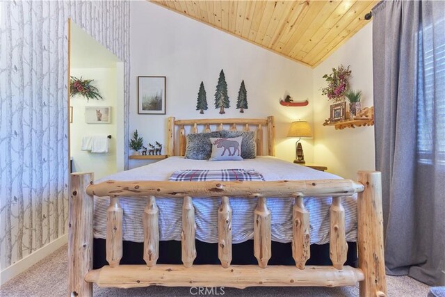 bedroom featuring lofted ceiling, wooden ceiling, carpet, and baseboards