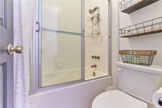 full bath featuring enclosed tub / shower combo and toilet