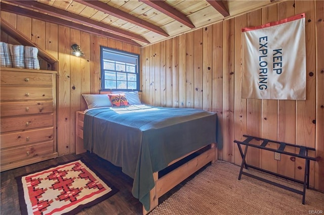 bedroom with wooden ceiling, wooden walls, and beamed ceiling