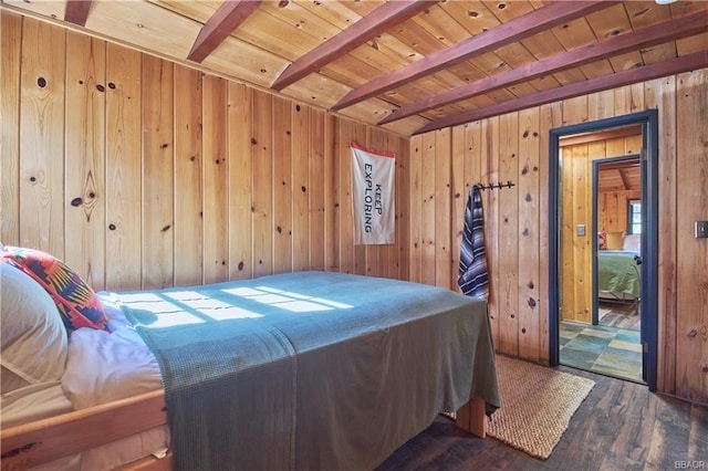 bedroom with wood ceiling, wooden walls, beamed ceiling, and wood finished floors