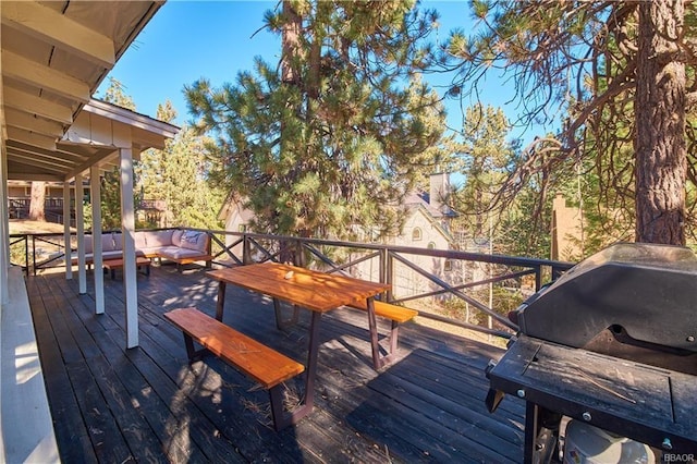 wooden deck with an outdoor living space