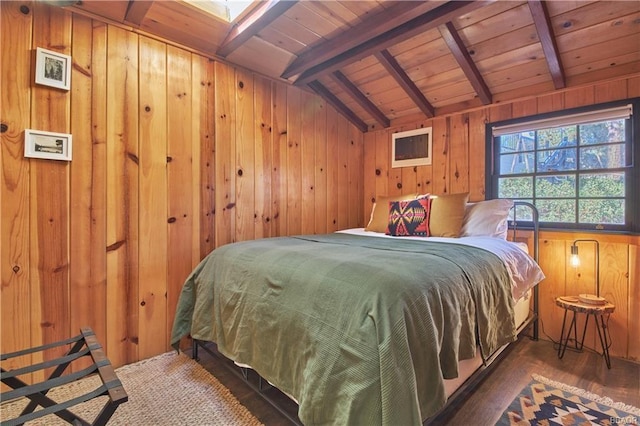 bedroom with vaulted ceiling with skylight, wood walls, wood finished floors, and wood ceiling