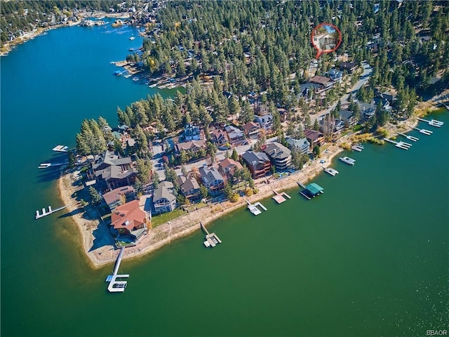 drone / aerial view featuring a water view and a residential view