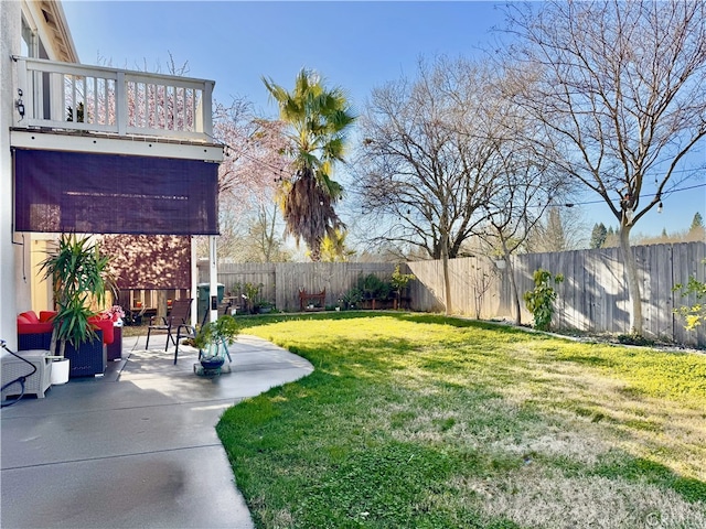 view of yard featuring a patio area and a fenced backyard