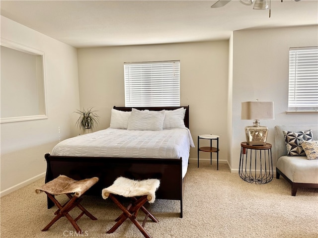 bedroom featuring baseboards and carpet