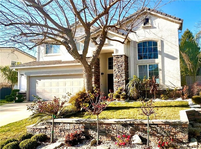 view of front facade with stone siding, a garage, driveway, and stucco siding