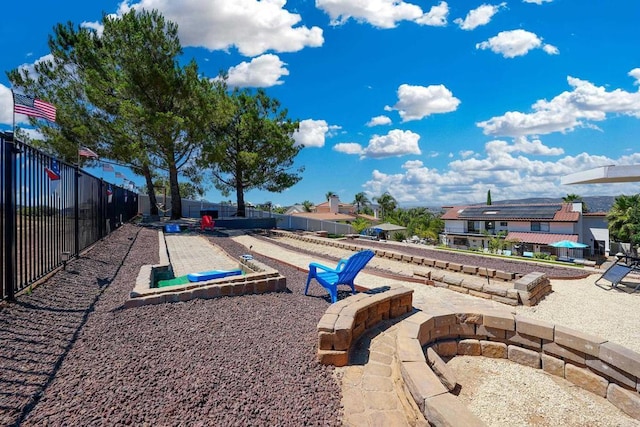 view of community featuring fence and a patio