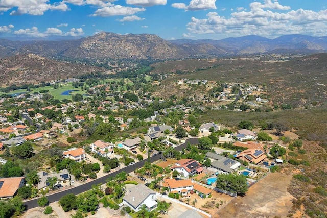 birds eye view of property with a residential view and a mountain view