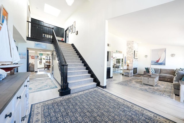 23767 Moonglow Ct, Ramona, CA 92065 - interior space with stairway, wood finished floors, and a towering ceiling