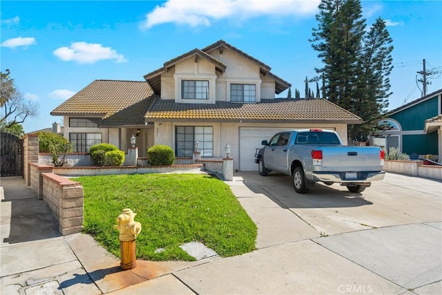 view of front facade with a garage, a tile roof, concrete driveway, and stucco siding