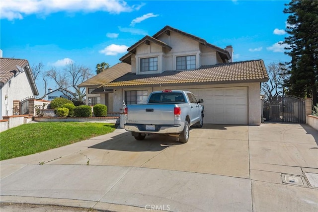 traditional home with a garage, a tiled roof, a gate, and stucco siding