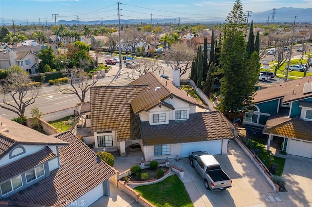 birds eye view of property with a residential view