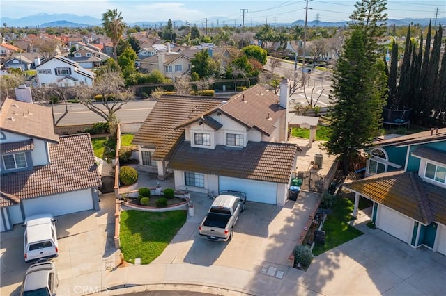 bird's eye view with a residential view and a mountain view