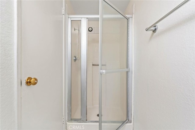 full bathroom featuring a stall shower